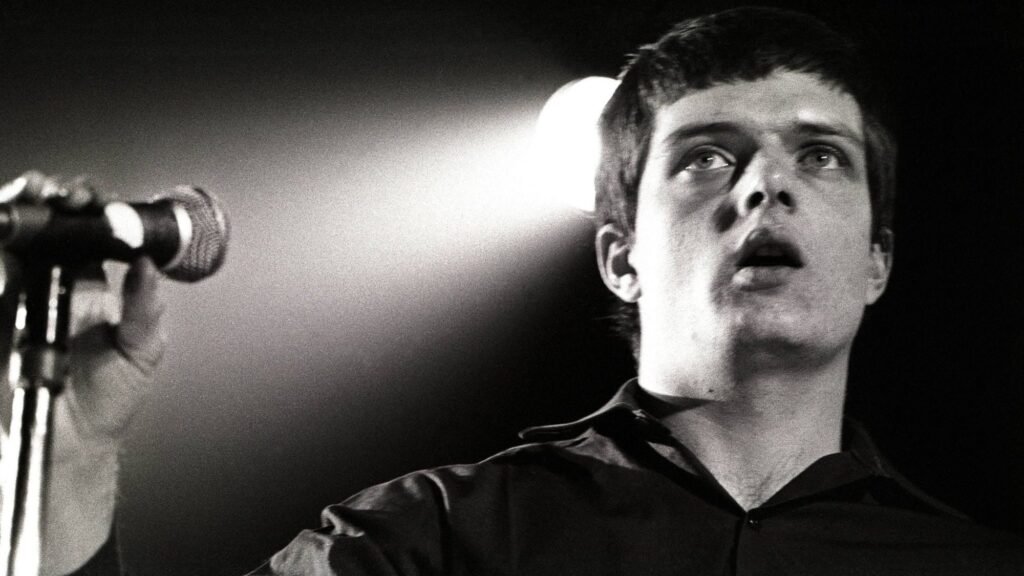 Joy Division. 's Ian Curtis performing live in 1980. Rob Verhorst/Redferns/Getty