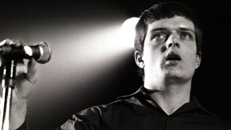 Joy Division. 's Ian Curtis performing live in 1980. Rob Verhorst/Redferns/Getty