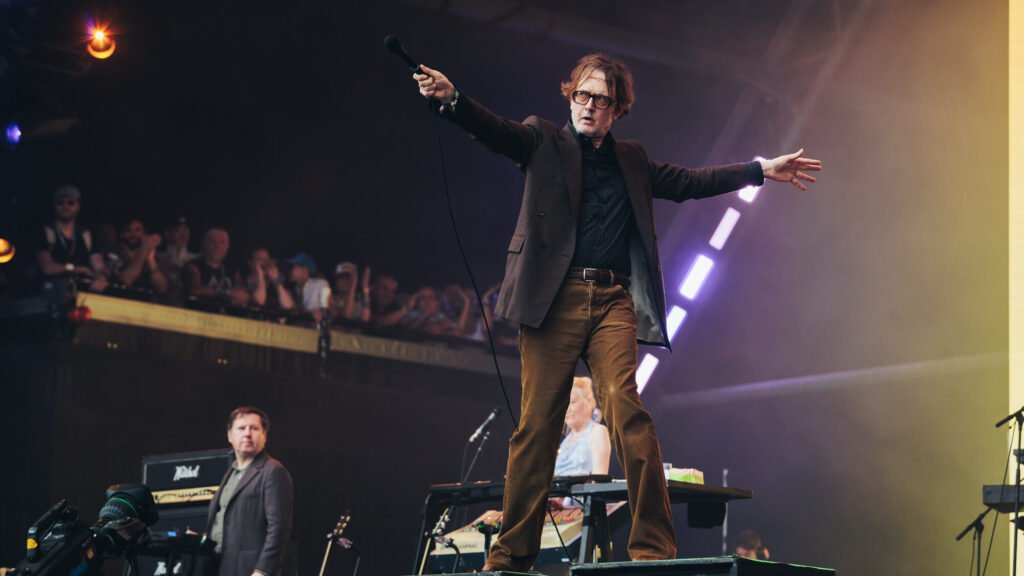 Pulp. Jarvis Cocker performs with  at Glastonbury 2025. Andy Ford for NME