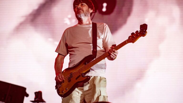 Blur. Alex James performs live with . Timothy Norris/Getty