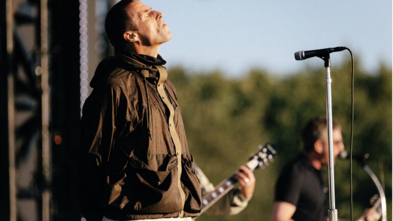 Oasis. Liam Gallagher performing live on stage with at Manchester's Heaton Park
