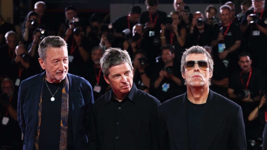 Oasis. Steven Knight, Noel Gallagher and Liam Gallagher attend the ': Don't Look Back in Anger' world premiere at the Venice International Film Festival 2026 (by Ernesto Ruscio/Getty Images)