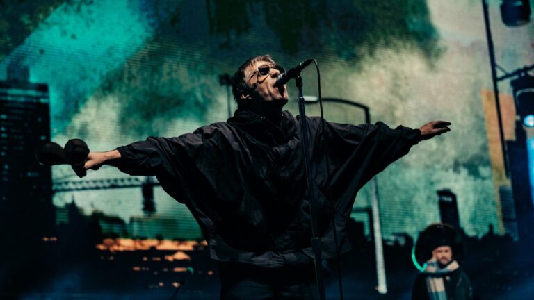 Oasis. Liam Gallagher performing live on stage with , by Big Brother Recordings